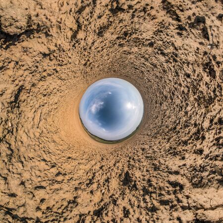 Little planet transformation of spherical panorama 360 degrees. Spherical abstract aerial view in field with awesome beautiful clouds. Curvature of space.の写真素材
