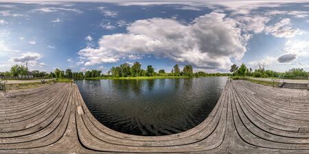 full seamless spherical hdri panorama 360 degrees  angle view on wooden pier of lake or rivere with...