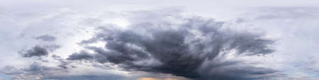 blue sky with beautiful dark clouds before storm. Seamless hdri panorama 360 degrees angle view with zenith for use in 3d graphics or game development as sky dome or edit drone shotの写真素材