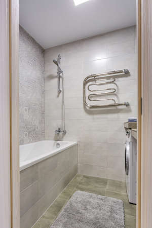water tap sink with faucet in expensive loft bathroom. detail of a corner shower cabin with wall...