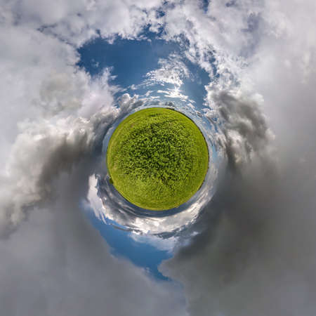 tiny planet transformation of spherical panorama 360 degrees. Spherical abstract aerial view on road with blue sky and awesome beautiful clouds. Curvature of space.の写真素材