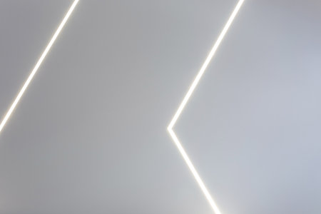 suspended ceiling with halogen spots lamps and drywall construction in empty room in apartment or...