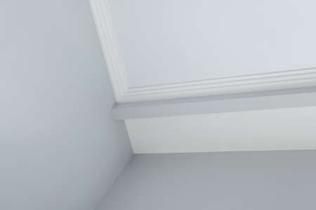 Detail of corner ceiling cornice with intricate crown molding.の写真素材