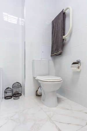 details of corner shower cabin with wall mount shower attachment and water tap sink with faucet in expensive bathroomの写真素材