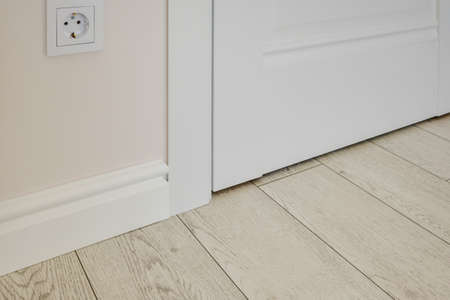 Detail of corner flooring with intricate crown molding and plinth.の写真素材