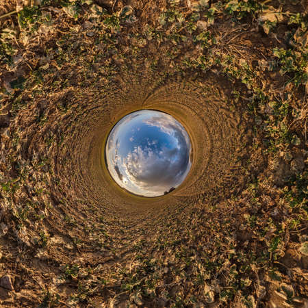 blue sky ball in middle of swirling field. Inversion of tiny planet transformation of spherical...