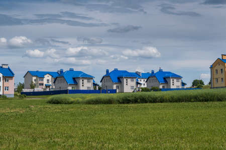 rows of colorful houses in a modern villageの写真素材