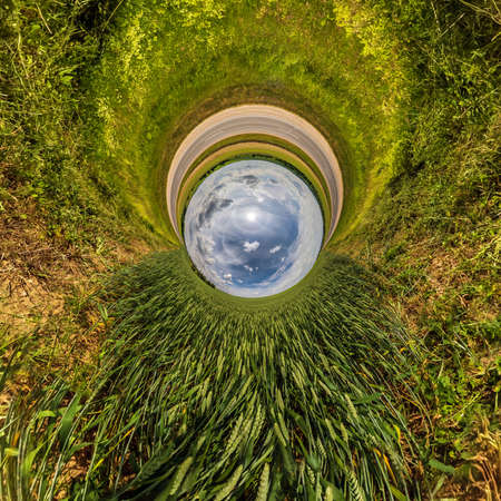 blue sky ball in middle of swirling sand road. Inversion of tiny planet transformation of spherical...