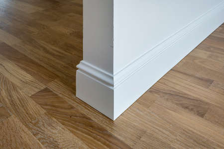Detail of corner flooring with intricate crown molding and plinth.の写真素材