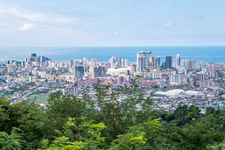 ariel panoramic view of old city and skyscrapers with the sea from the mountainsのeditorial素材