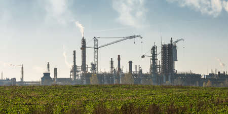Industrial landscape environmental pollution waste of thermal power plant. Big pipes of chemical...
