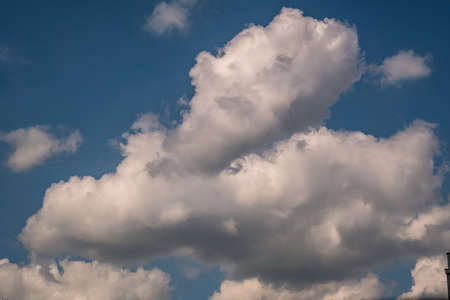 Blue sky background with big white striped clouds. blue sky panorama may use for sky replacementの写真素材