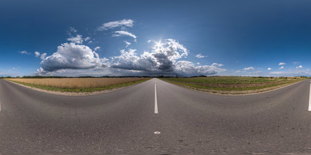 full seamless spherical hdri 360 panorama on old no traffic asphalt road among fields before storm in equirectangular projection, ready for VR AR virtual realityの写真素材