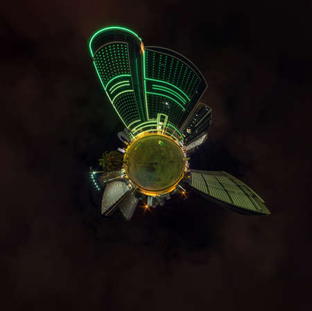 tiny planet in night sky in city center near modern skyscrapers or office buildings. Transformation of spherical 360 panorama in abstract aerial view.の写真素材