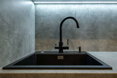 water tap sink with faucet in expensive kitchenの写真素材