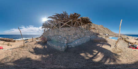 full hdri seamless spherical 360 panorama near thatched hut with daybeds and cushions for relaxing...