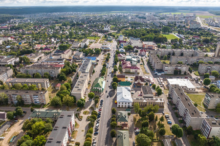 panoramic view from a great height of a small provincial town with a private sector and high-rise apartment buildingsの写真素材