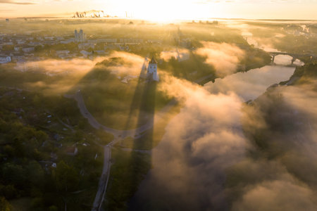 earlier foggy morning and aerial panoramic view on medieval castle and promenade overlooking the old...