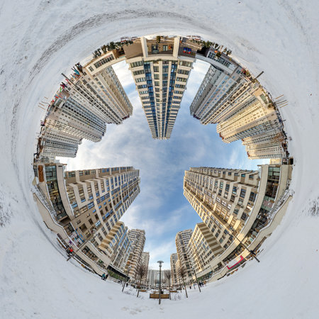 everted tiny planet in blue sky with clouds in city center near modern skyscrapers or office...