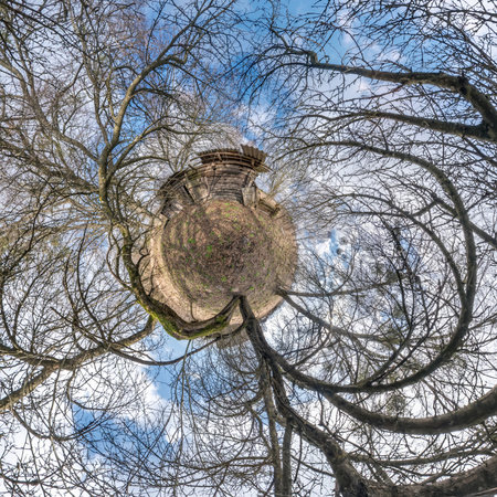 tiny planet in abandoned village near old house in blue sky with beautiful clouds. Transformation of...