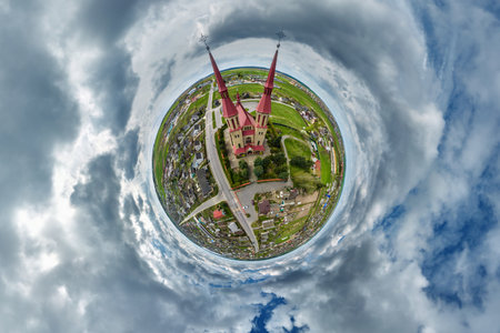 little planet transformation of spherical panorama 360 degrees overlooking church in center of globe in blue sky. Spherical abstract aerial view with curvature of space.の写真素材