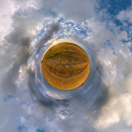 simple tiny planet without buildings in blue sky with beautiful clouds. Transformation of spherical panorama 360 degrees. Spherical abstract aerial view. Curvature of space.の写真素材