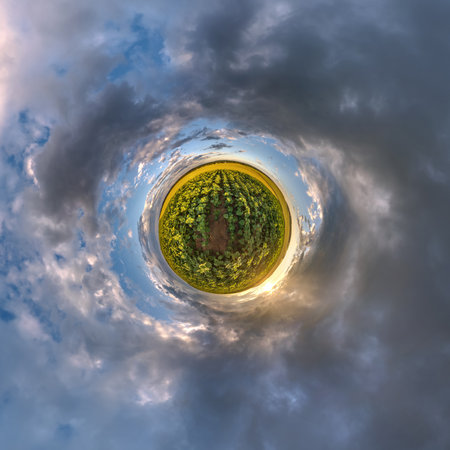 simple tiny planet without buildings in blue sky with beautiful clouds. Transformation of spherical panorama 360 degrees. Spherical abstract aerial view. Curvature of space.の写真素材
