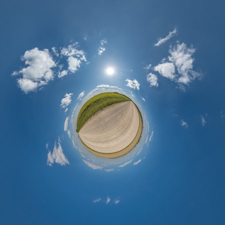 simple little tiny planet without buildings in blue sky with beautiful clouds. Transformation of spherical panorama 360 degrees. Spherical abstract aerial view. Curvature of space.の写真素材
