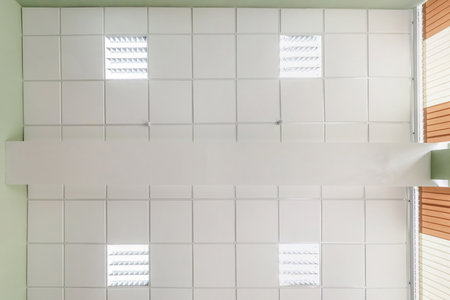 cassette stretched or suspended ceiling with square halogen spots lamps and drywall construction in...
