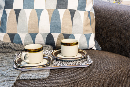 Two cups of coffee on the tray on the armchairの写真素材