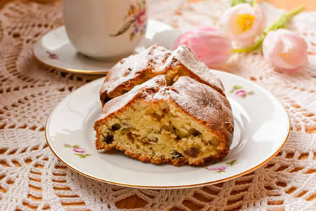 Fresh homemade cake served on the plate on the crocheted table cloth