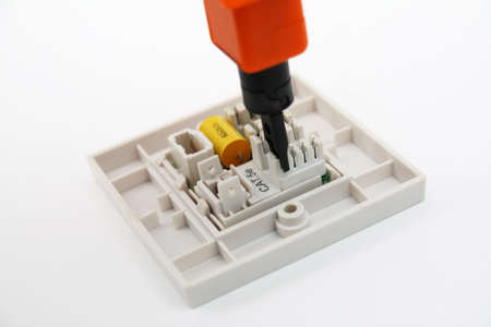 Punch-down tool on RJ45 wall socket