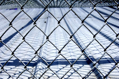 Chain link fence over roof with diamond designs
