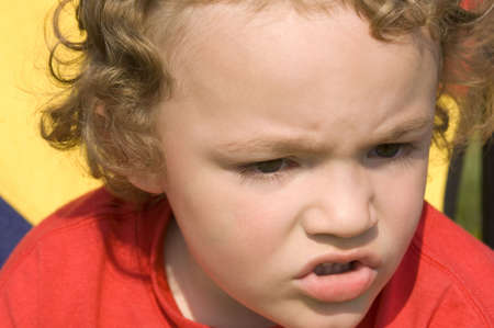 Young boy with frustrated look on his face