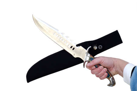 Hand holding large hunting sharp metal knifeの写真素材