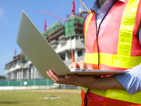 Construction worker with a pc