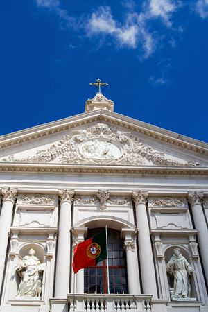 a perspective of a church showing the sky and a flagの写真素材