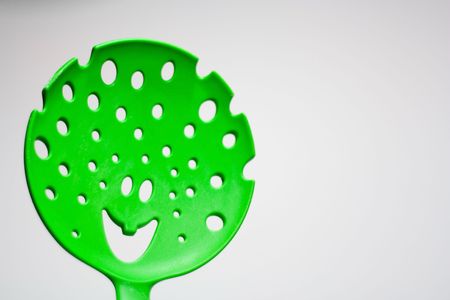 A smiling spoon on white background (focus on the smile)の写真素材