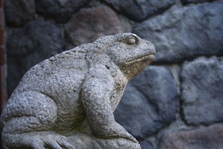 a statue of a frog preparing to jumpの写真素材