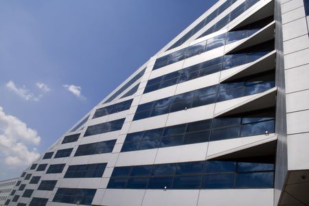 a graphic perspective of office windows with clouds reflected