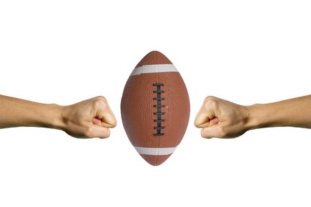 Two hands trying to smashing a footballの写真素材