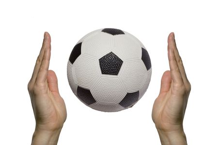 two hands holding a soccer ballの写真素材