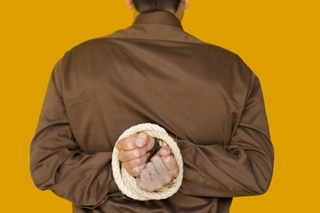a bussiness man with his hands tiedup (focus on the hands)