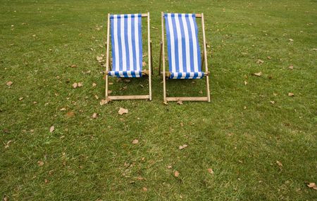 two lonely striped chairs on the parkの写真素材