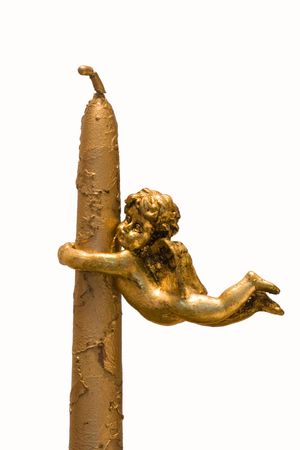 an angel attach to a candle isolated on white with clipping pathの写真素材