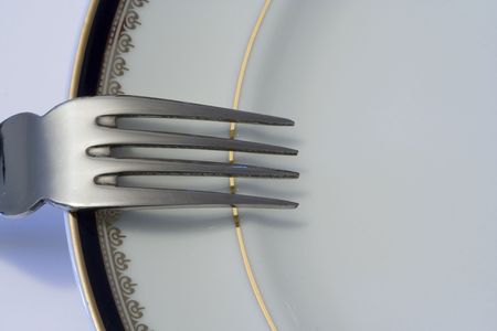 a fork for fish over a plate