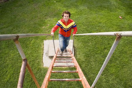 men climbing up the stairs in a parkの写真素材