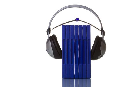 headphones holding blue cases isolated in white with reflectionの写真素材