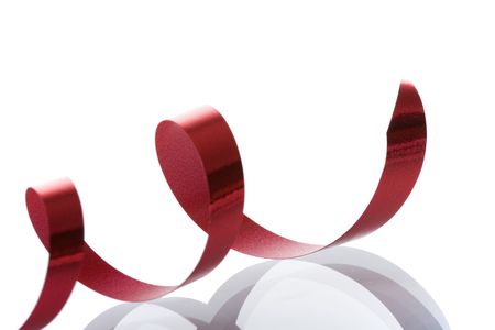 a detail of a red ribbon isolated on white (selective focus)の写真素材