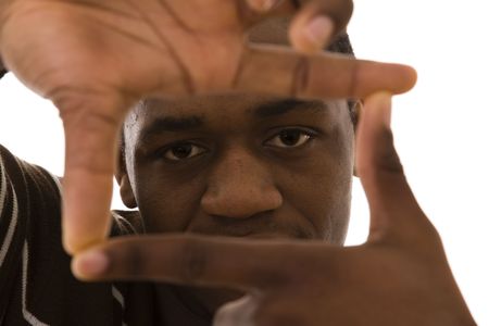 african young man finger framing with his hands (selective focus)の写真素材